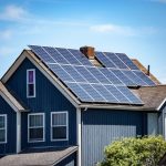 Grey Home with Solar panels | TitaniumInvest